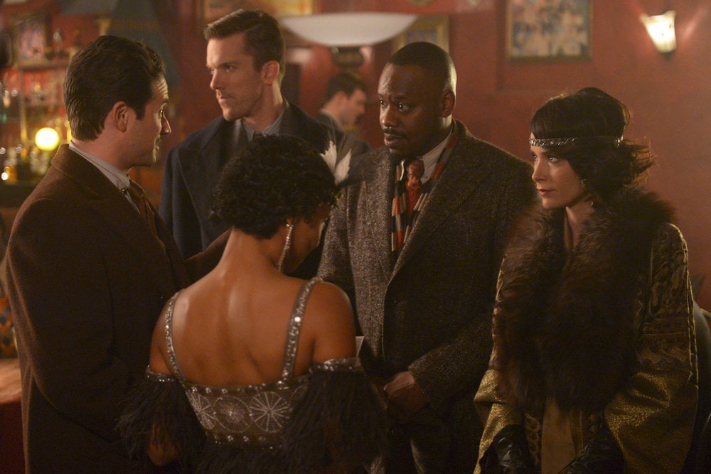 TIMELESS -- "The Lost Generation" Episode 113 -- Pictured: (l-r) Brandon Barash as Hemingway, Malcolm Barrett as Rufus Carlin, Abigail Spencer as Lucy Preston -- (Photo by: Sergei Bachlakov/NBC) Timeless Photo Preview: The Roaring Twenties - Part 3